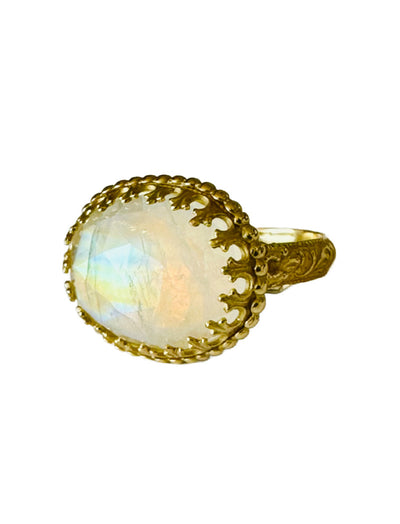 This beautiful 18K recycled gold ring is simple, elegant, and timeless. The 13x18mm oval Rose Cut Rainbow Moonstone is set in a delicate filigree bezel, surrounded by tiny gold dots. The shank has a beautiful pattern. This unique stone will spark joy every time you look at it!

Size 9
