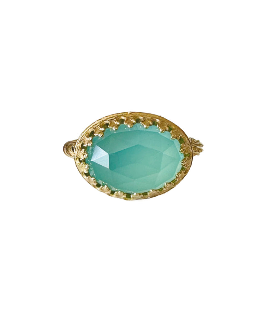 This beautiful 18K recycled gold ring is simple, elegant, and timeless. The 14x10mm oval rose cut aqua chalcedony is set in a delicate filigree bezel. The shank is a beautiful round swirling pattern, that evokes ancient jewels. This ring was inspired by Ancient Greek and Roman jewelry, which is one of my favorite jewelry. I named the ring Amare which means Love in Latin, &nbsp;love is what is behind all my work!&nbsp;
