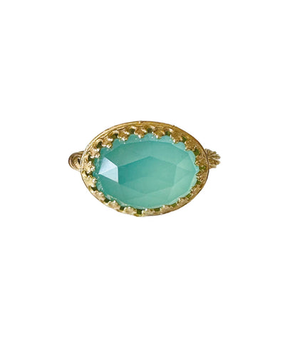 This beautiful 18K recycled gold ring is simple, elegant, and timeless. The 14x10mm oval rose cut aqua chalcedony is set in a delicate filigree bezel. The shank is a beautiful round swirling pattern, that evokes ancient jewels. This ring was inspired by Ancient Greek and Roman jewelry, which is one of my favorite jewelry. I named the ring Amare which means Love in Latin, &nbsp;love is what is behind all my work!&nbsp;
