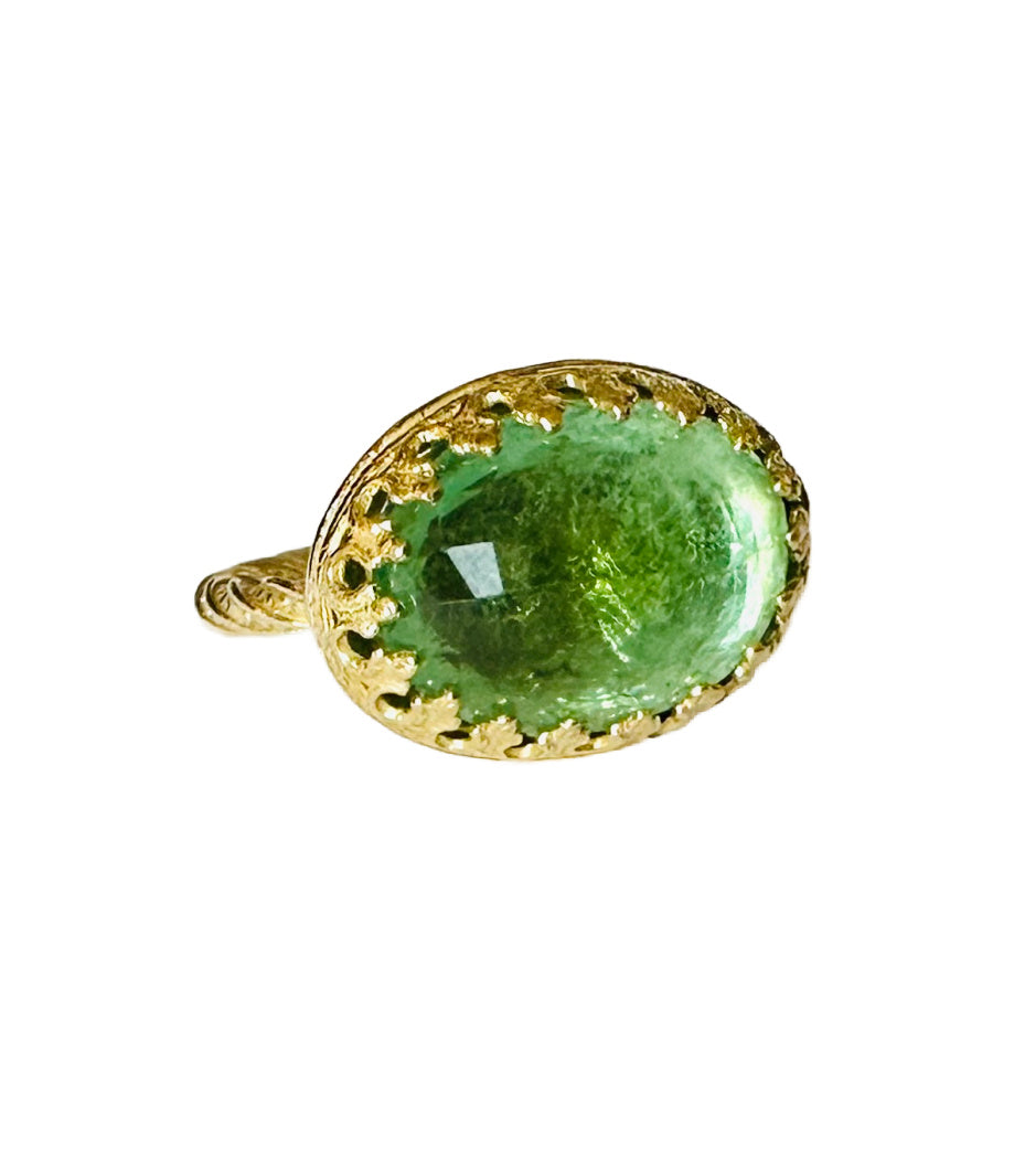 This beautiful 18K recycled gold ring is simple, elegant, and timeless. The 14x10mm oval faceted green tourmaline is set in a delicate filigree bezel. The shank is a beautiful round swirling pattern, that evokes ancient jewels. This ring was inspired by Ancient Greek and Roman jewelry, which is one of my favorite jewelry. I named the ring Amare which means Love in Latin, &nbsp;love is what is behind all my work!&nbsp;