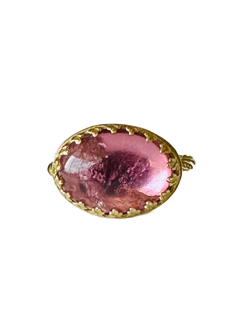 This beautiful 18K recycled gold ring is simple, elegant, and timeless. The 14x10mm oval cabochon pink tourmaline is set in a delicate filigree bezel. The shank is a beautiful round swirling pattern, that evokes ancient jewels. This ring was inspired by Ancient Greek and Roman jewelry, which is one of my favorite jewelry. I named the ring Amare which means Love in Latin, &nbsp;love is what is behind all my work!&nbsp;