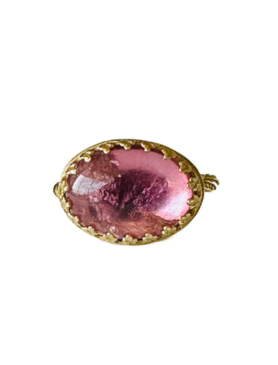 This beautiful 18K recycled gold ring is simple, elegant, and timeless. The 14x10mm oval cabochon pink tourmaline is set in a delicate filigree bezel. The shank is a beautiful round swirling pattern, that evokes ancient jewels. This ring was inspired by Ancient Greek and Roman jewelry, which is one of my favorite jewelry. I named the ring Amare which means Love in Latin, &nbsp;love is what is behind all my work!&nbsp;