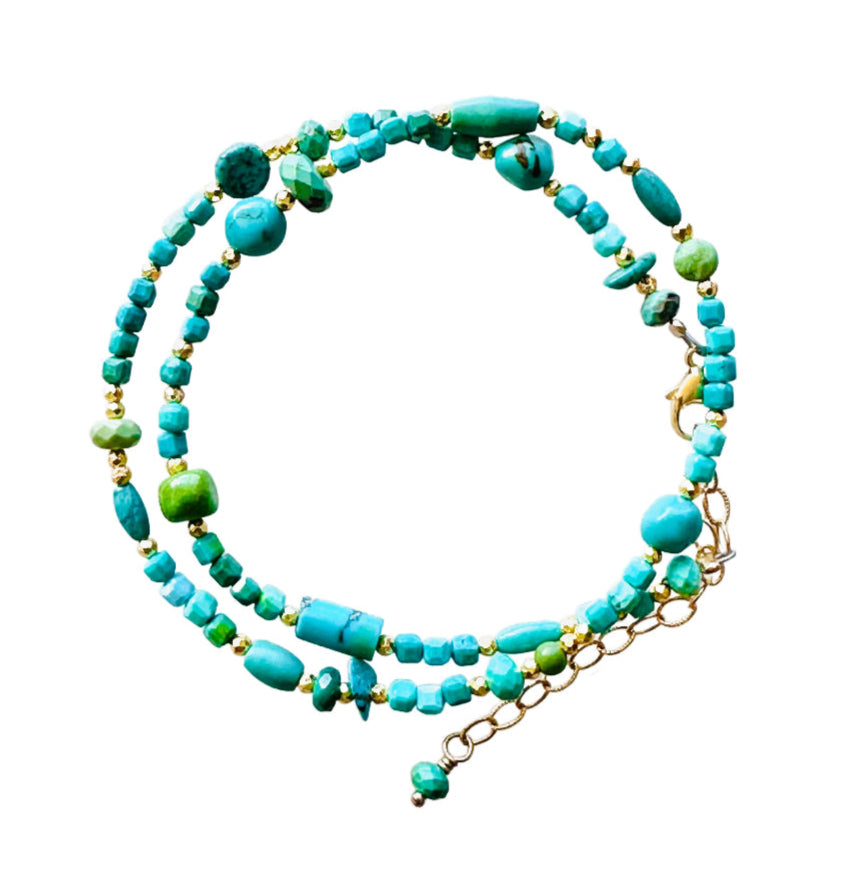 Turquoise &amp; pyrite beaded wrap double strand bracelet with gold fill lobster clasp, and gold-filled extender chain. It wraps around the wrist twice. 12.5" to 14.75" long with turquoise adornment at the end of extender.