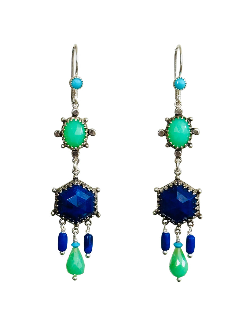 These elegant earrings are a versatile medium &nbsp;size chandelier. They feature a rose cut hexagon lapis lazuli framed in a delicate lacy bezel with an open back.&nbsp;

From the hexagon hangs a faceted chrysoprase drop with a small turquoise on top and two small cylindrical lapis lazuli drops on either side.&nbsp;

Above the hexagon is an oval rose cut chrysoprase set in a bezel with silver dot adornments. The ear wires have a turquoise accent.

Materials: Recycled Sterling Silver, lapis lazuli, chrysopr