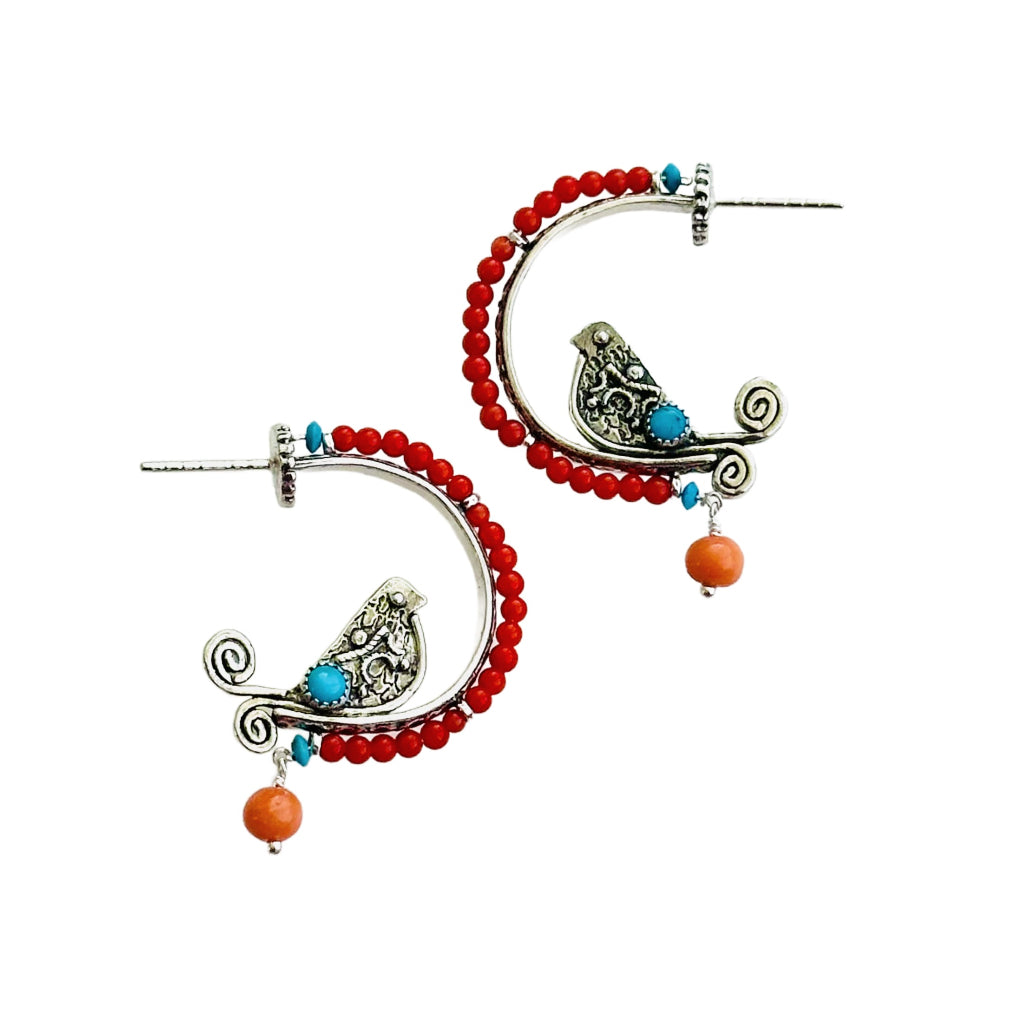 Coral & Turquoise Small Beaded Silver Bird Hoop

This is a whimsical, fun, and unique earring! The hoop itself has a beautiful floral pattern, the bird is engraved and has a detail wing and gem stone set on both sides. The hoop has a border of 2.5mm coral with a turquoise accent at either end, a turquoise gem set in a silver bezel, and a Victorian coral dangle from the bottom.