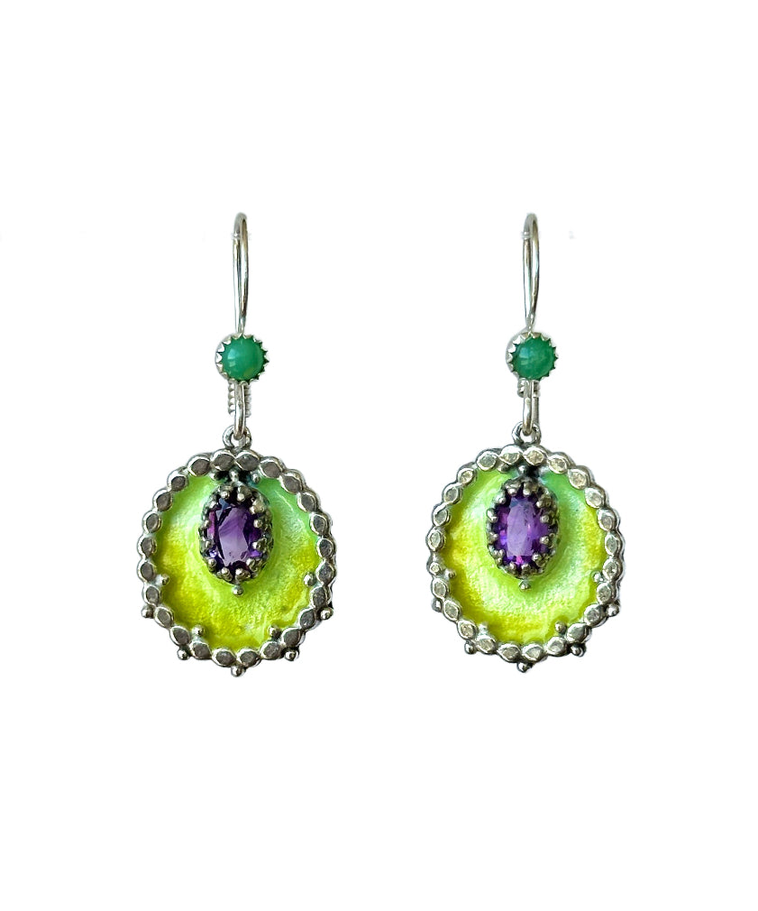 Small oval enameled medallions surrounded by silver dots, with a beautiful faceted amethyst set &nbsp;in a lacy bezel. There is a small chrysoprase accent on the ear wire.&nbsp;

These earrings are small statement pieces that add a pop of color and sophistication to your look.&nbsp;