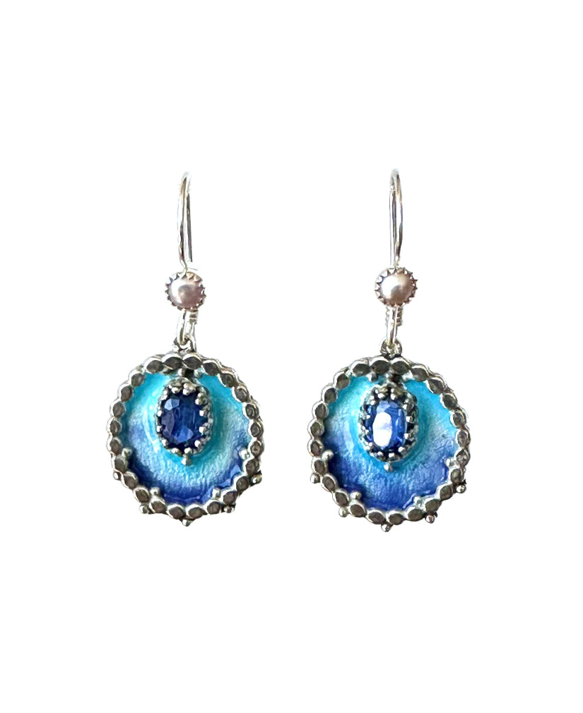 Small oval enameled medallions surrounded by silver dots, with a beautiful faceted kyanite set in a lacy bezel. There is a small pearl accent on the ear wire.

These earrings are small statement pieces that add a pop of color and sophistication to your look.