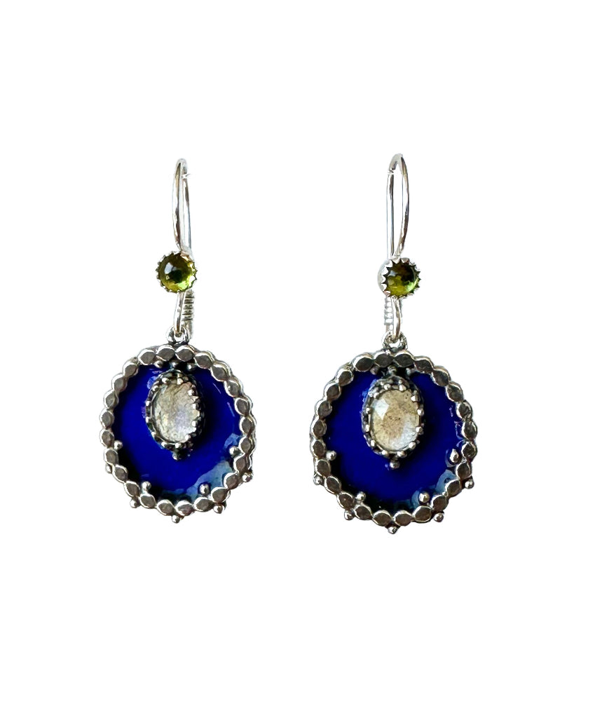 Small oval enameled medallions surrounded by silver dots, with a beautiful rose cut labradorite set &nbsp;in a lacy bezel. There is a small peridot accent on the ear wire.&nbsp;

These earrings are small statement pieces that add a pop of color and sophistication to your look.&nbsp;
