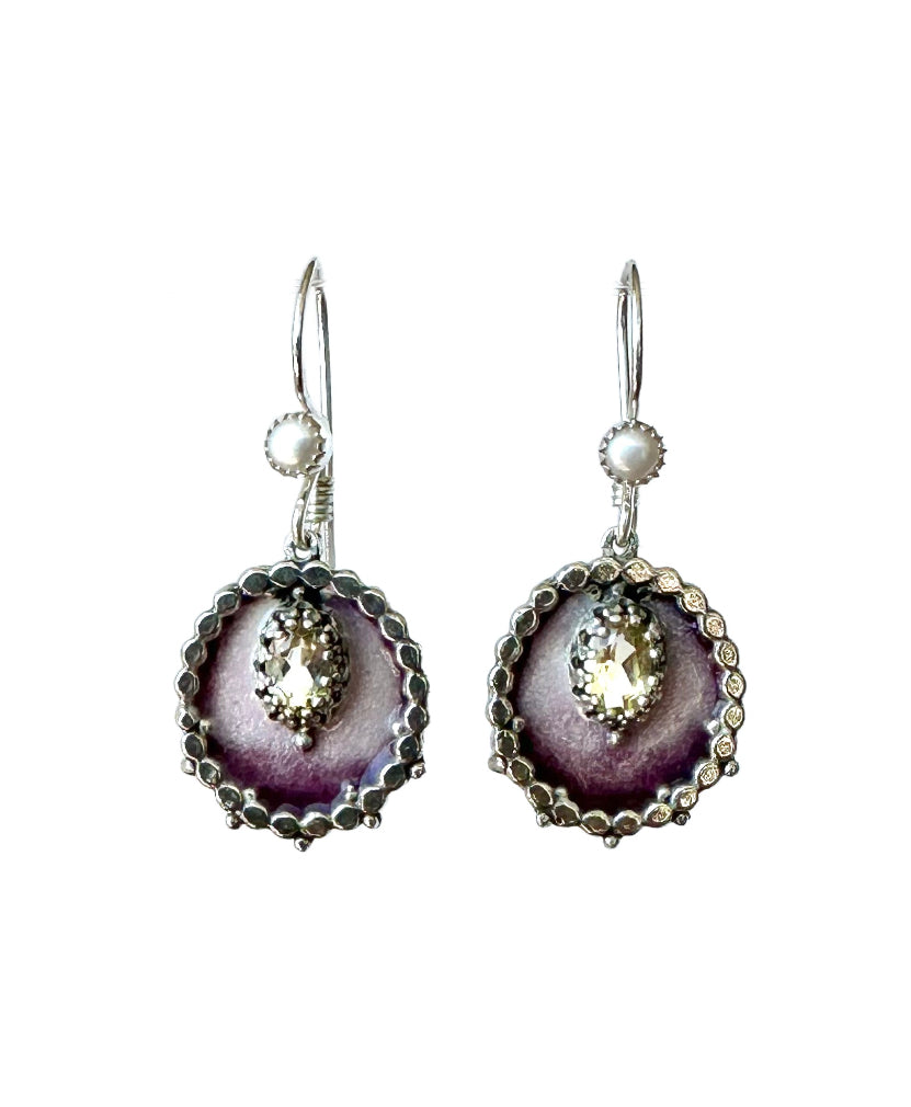 Small Enameled Medallion Lemon Citrine &amp; Pearl Earrings

Small oval enameled medallions surrounded by silver dots, with a beautiful faceted lemon citrine set &nbsp;in a lacy bezel. There is a small pearl accent on the ear wire.&nbsp;

These earrings are small statement pieces that add a pop of color and sophistication to your look.&nbsp;