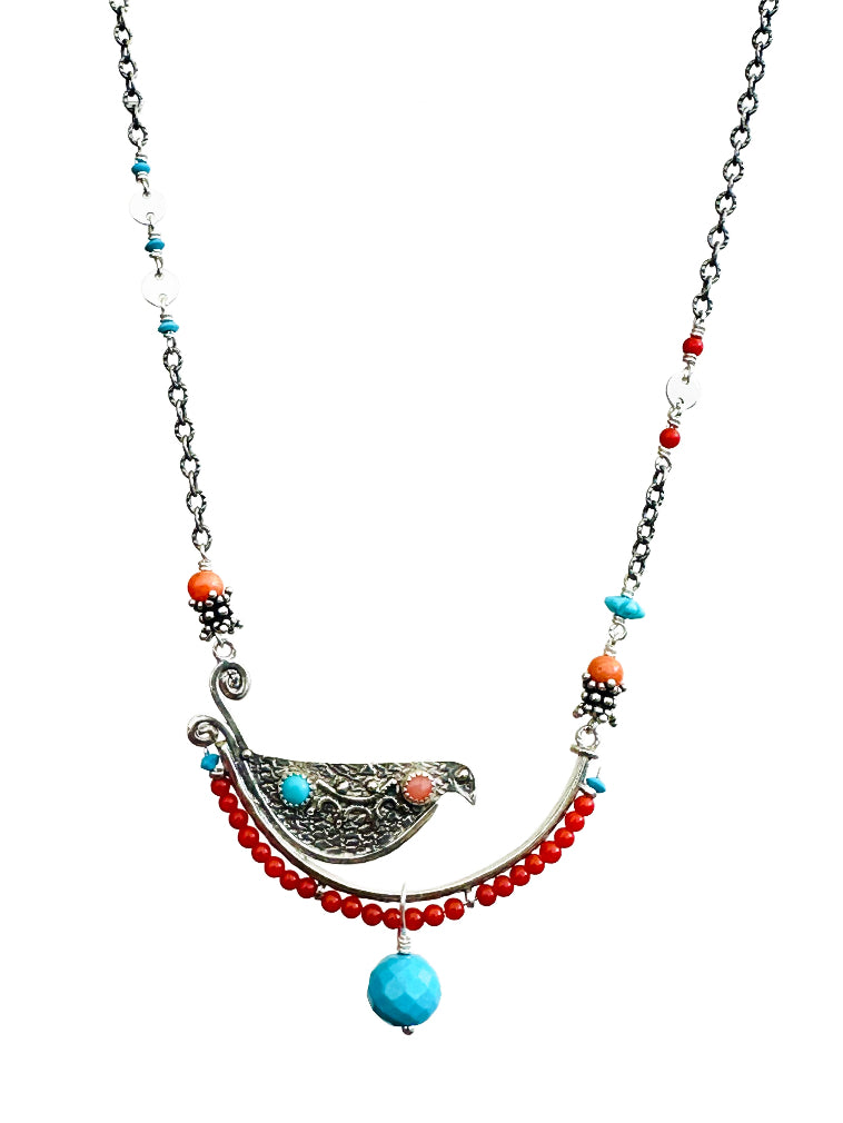 Coral & Turquoise Beaded Bird Necklace - Silver

This is a whimsical, fun, and unique necklace!

The bird sits on a silver arch that has a beautiful floral pattern. The bird is engraved and has a detail wing on both sides. On the front side of the bird, there are two gems set.

The silver arch has a border of 2.5mm coral with a & turquoise accent at either end, a cabochon turquoise and coral gems are set in a silver bezel near the tail and head, and a beautiful faceted sleeping beauty turquoise