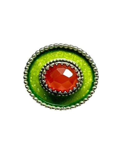 Carnelian Green Sombrero Ring A horizontal 1"x7/8" oval with bright green enamel and a darker green border, has a 11x9mm rose cut carnelian set in the center, in a lacy bezel. The band has a delicate floral pattern, is 1/8" and sturdy. This ring is a size 6.5