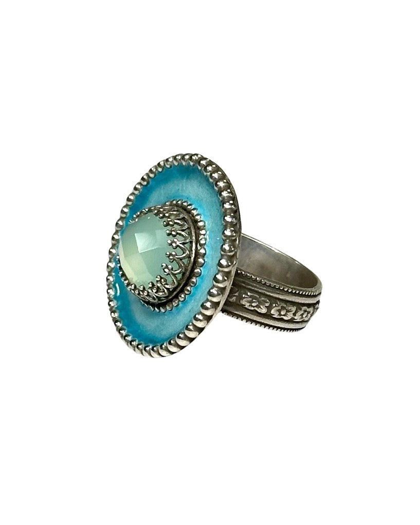 A horizontal 1"x7/8" oval with a light blue with a turquoise border enamel,  has a 11x9mm beautifully cut lemon citrine set in the center, in a lacy bezel. The band has a delicate floral pattern, is 1/8" and sturdy.    This ring is a size 7.5  Materials: Sterling silver, enamel & aqua chalcedony  This ring is unique, fun, beautiful and colorful! 