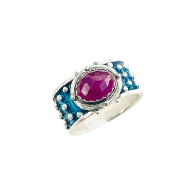 Pink Sapphire Enameled &nbsp;Wide Band Ring&nbsp;

Beautiful enameled band &nbsp;with silver dots all around and a rose cut pink sapphire set horizontally.&nbsp;