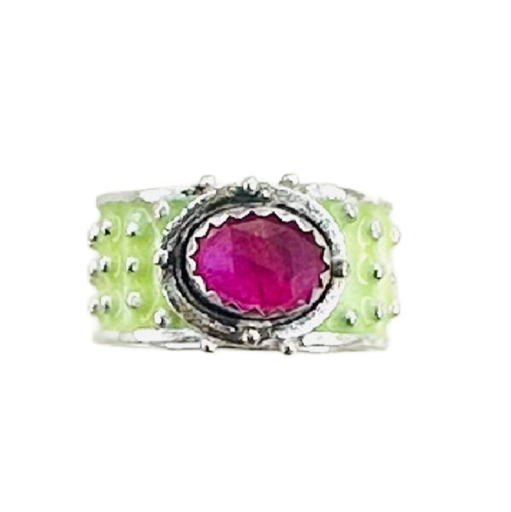 Ruby Enameled &nbsp;Wide Band Ring&nbsp;

Beautiful enameled band &nbsp;with silver dots all around and a rose cut beautiful ruby set horizontally.