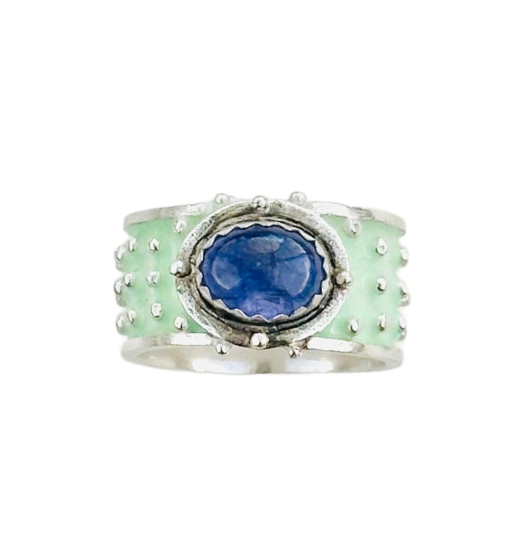 Ruby Enameled &nbsp;Wide Band Ring&nbsp;

Beautiful enameled band with silver dots all around and a rose cut beautiful ruby set horizontally.