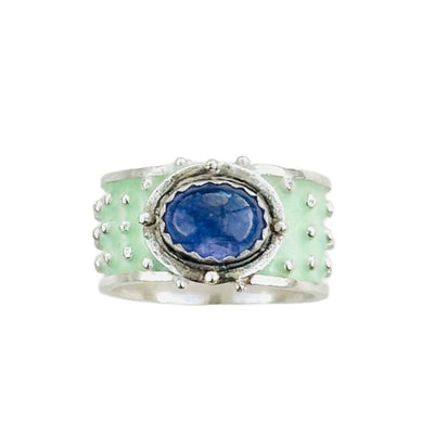 Ruby Enameled &nbsp;Wide Band Ring&nbsp;

Beautiful enameled band with silver dots all around and a rose cut beautiful ruby set horizontally.
