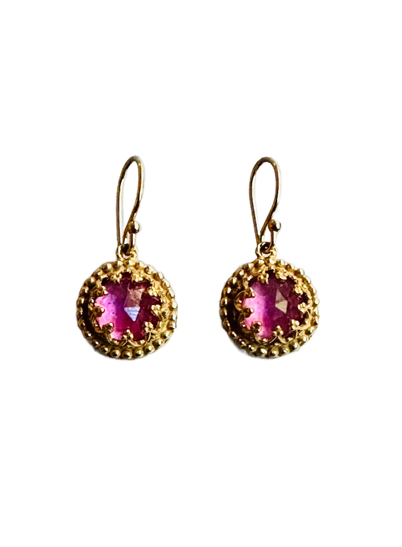 Beautiful 7mm rose cut pink sapphire&nbsp;stone set in a delicate filigree bezel, surrounded by tiny dots. These earrings are 18K gold plated over sterling silver (vermeil). This is a classic design that can be worn daily.
