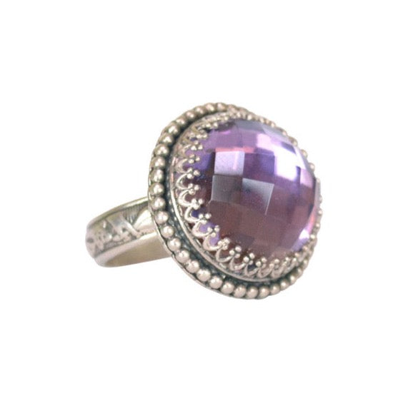 Amethyst Cocktail Ring  This is such a fun, and elegant ring! A beautifully cut 16mm amethyst stone is set in a filigree bezel, and surrounded by a strand of tiny silver dots. The shank has a beautiful botanical pattern. Perfect with jeans or a gown.  Materials: Sterling silver & amethyst  Ring available in size 7, 7.5, 8.75 & 9.5