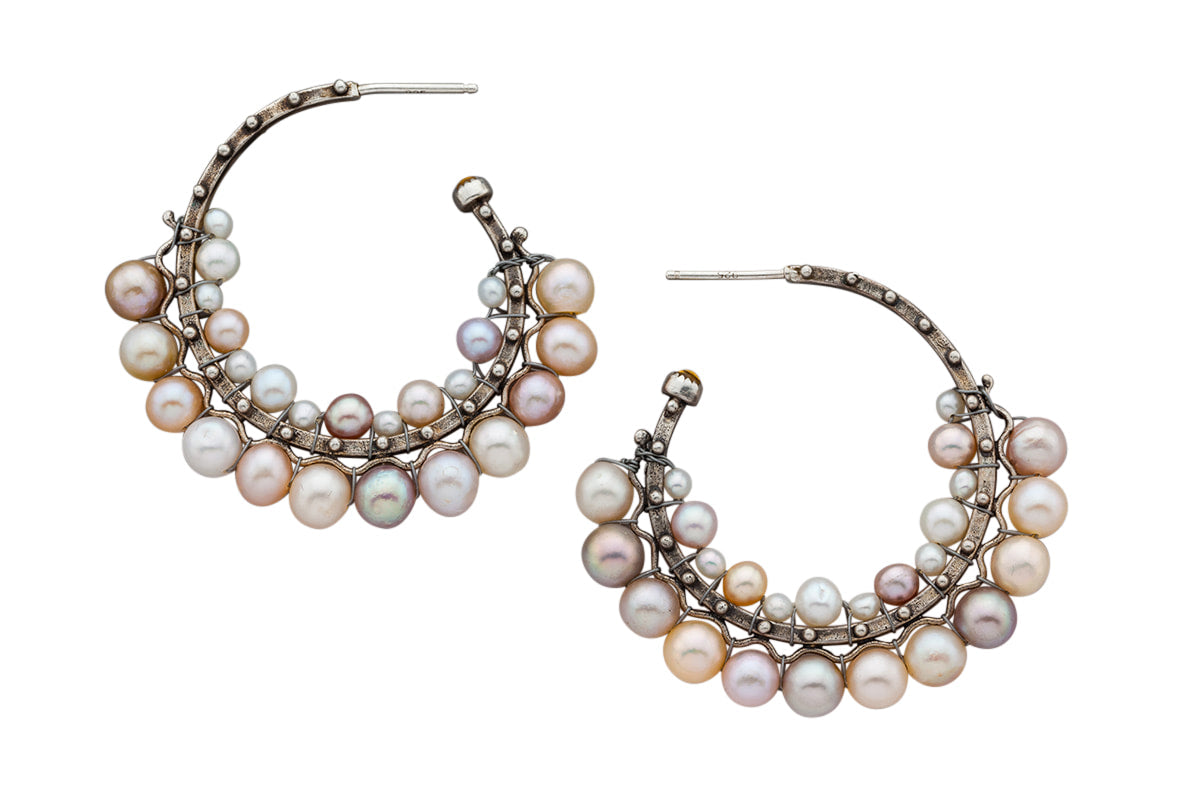 Woven Pearl Silver Hoop Earrings  These beautiful hoops are classic, bohemian, yet modern. The silver hoops have intricately woven multi colored fresh water pearls. There is a 3mm pearl set at the open side of the hoop. You will love these, they are comfortable and versatile!  These come in two sizes:  Large hoops are 1 3/4" in diameter  Medium hoops are 1 1/2" in diameter  Materials: Sterling silver & pearls