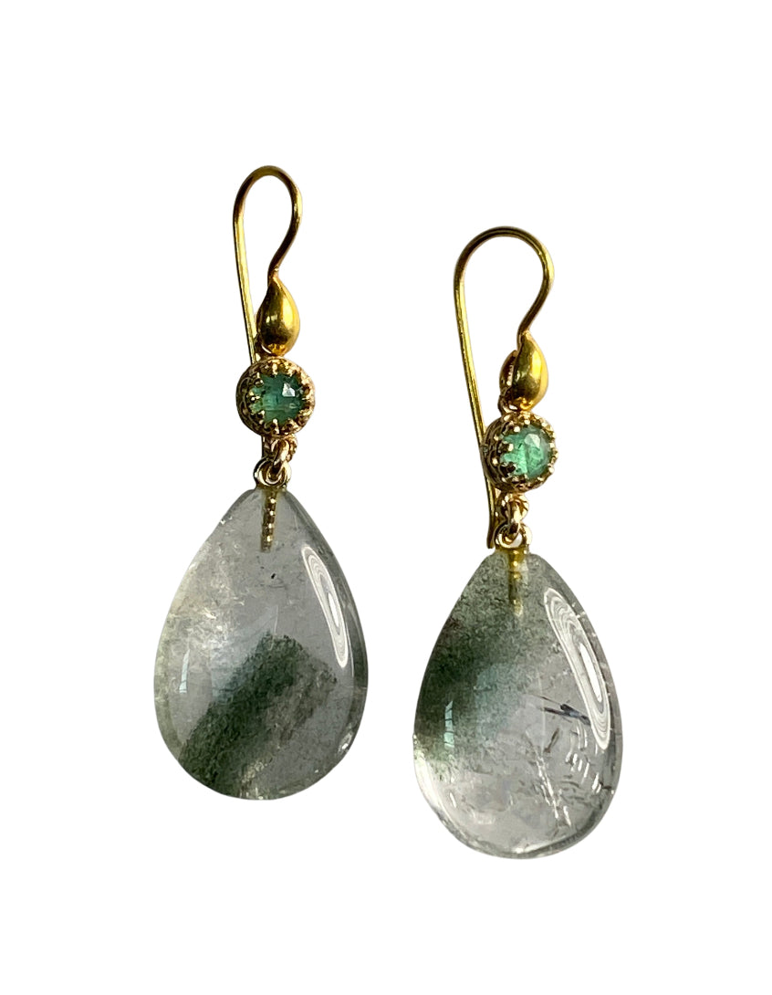 Gorgeous Chlorite Quartz Crystal drops hang from rose cute 4mm Brazilian emeralds wrapped in a lacy 18K recycled gold bezel. The ear wires have a beautiful drop shaped design which adds to the elegance of these timeless earrings.