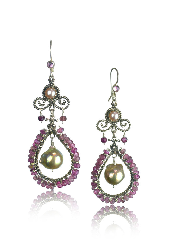 Pink Tourmaline & Baroque Pearl Beaded Chandelier
Gorgeous beaded chandeliers. Filigree drop shape surrounded by faceted pink tourmalines, and beautiful baroque pearl hanging on the inside. On top is a 5mm pearl set in a filigree bezel, surrounded by tiny silver dots, and pink tourmaline bead dangles. The ear wires have a 3mm pearl accent.