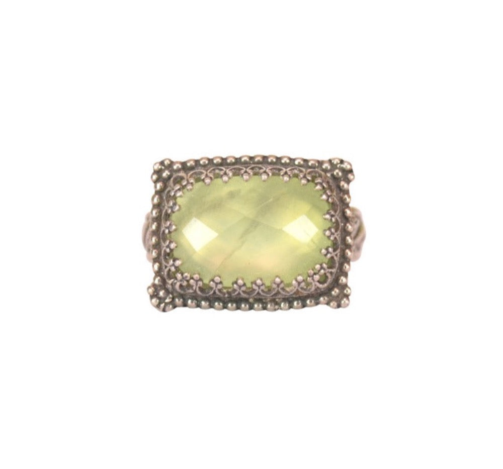Prehnite Rectangular Ring   Checker cut 14x10mm prehnite stone, set in a filigree bezel. Bezel surrounded by baby silver dots. Ring has a pattern band with special detail next to the setting.  Ring available in size 5.5, 6.5, 7.5, 8.5, 9.25 & 10.  Materials: Sterling silver & prehnite