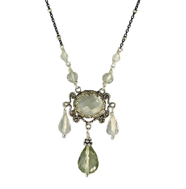 Three Drop Green Amethyst Necklace  Faceted 10x8mm green amethyst set in lacy bezel, surrounded by filigree work. Three faceted green amethyst drops hang from pendant, and two green amethyst beads lead to the delicate oxidized chain. This an elegant, delicate, necklace that can be worn daily.  Materials: Sterling silver & green amethyst  Length: 17" 