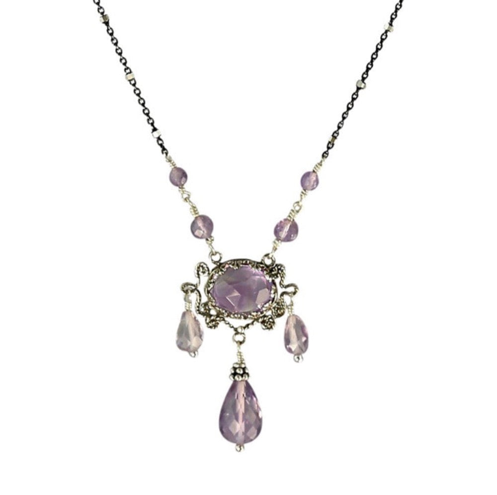Three Drop Pink Amethyst Silver Necklace   Faceted rose cut 10x8mm pink amethyst set in lacy bezel, surrounded by filigree work. Three faceted pink amethyst drops hang from pendant, and two amethyst beads lead to the fine oxidized silver chain. This elegant and delicate necklace can be worn daily. Necklace is 17" long.   Materials: Sterling silver & pink amethyst