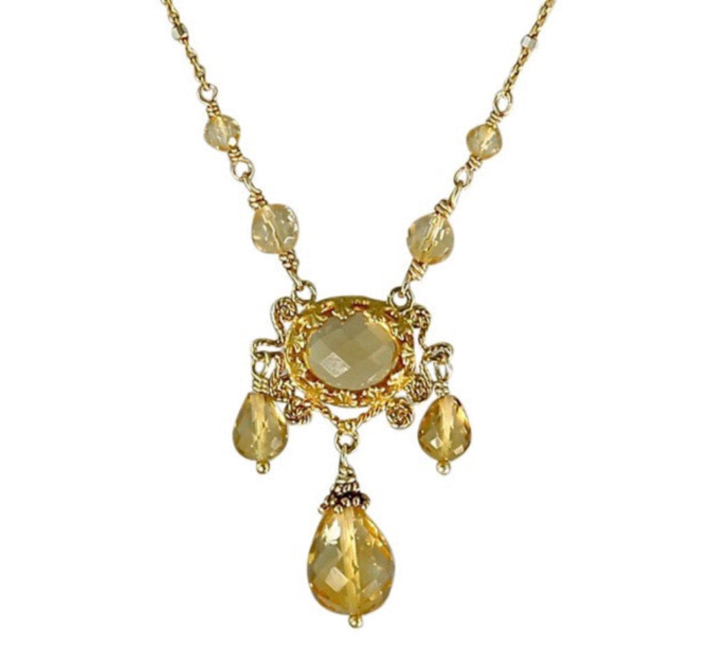 Three Drop Citrine 18K Gold Vermeil Necklace  Rose cut 10x8mm citrine set in lacy bezel, surrounded by filigree work. Three faceted citrine drops hang from pendant, and two citrine beads lead to the delicate chain. This an elegant, delicate, necklace that can be worn daily.  ​Materials: 18K gold vermeil, gold-fill chain, and citrine  Length: 17 inches