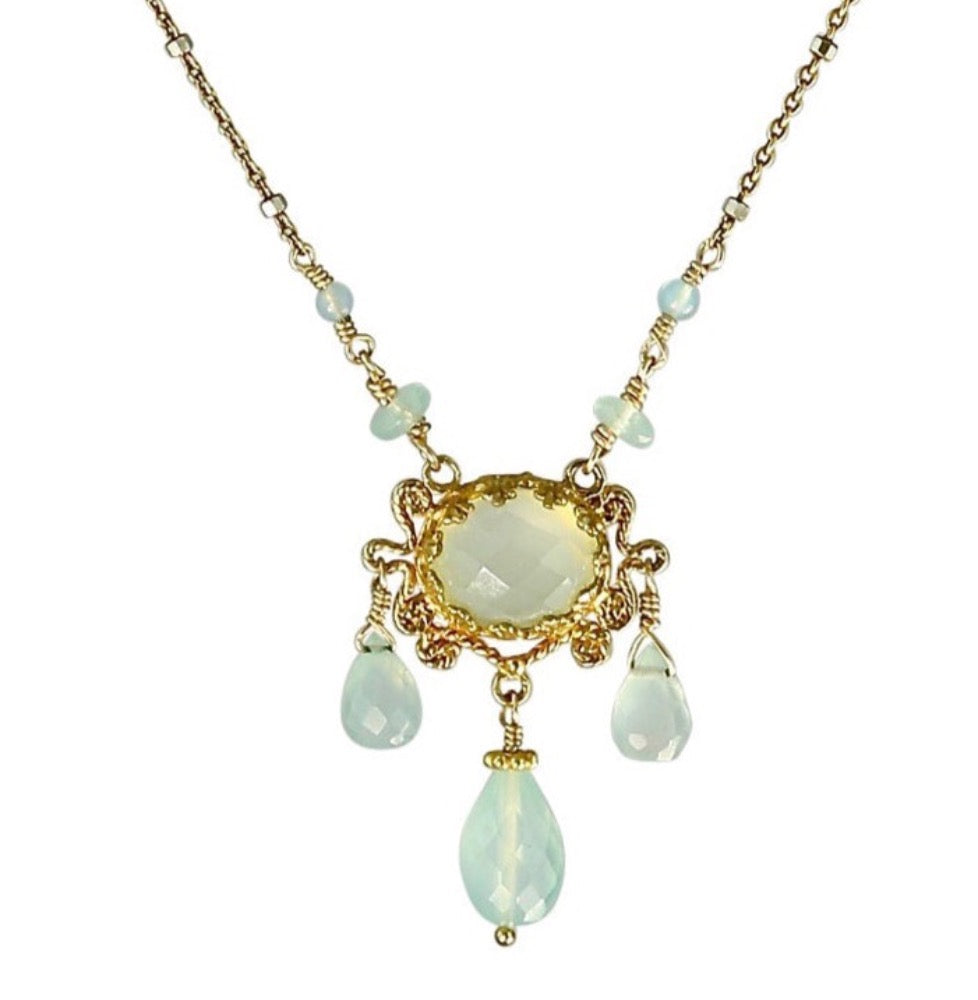 Three Drop Aqua Chalcedony 18K Gold Vermeil Necklace  Rose cut 10x8mm aqua chalcedony set in lacy bezel, surrounded by filigree work. Three faceted aqua chalcedony drops hang from pendant, and two aqua chalcedony beads lead to the delicate chain. This an elegant, delicate, necklace that can be worn daily.  ​Materials: 18K gold vermeil, gold-fill chain, and aqua chalcedony  Length: 17 inches