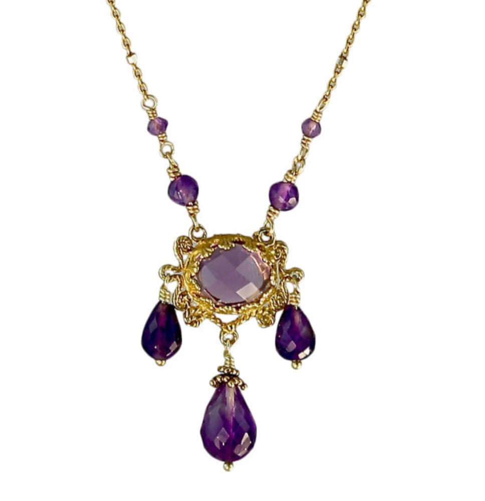 Three Drop Amethyst 18K Gold Vermeil Necklace  Rose cut 10x8mm amethyst set in lacy bezel, surrounded by filigree work. Three faceted amethyst drops hang from pendant, and two amethyst beads lead to the delicate chain. This an elegant, delicate, necklace that can be worn daily.  ​Materials: 18K gold vermeil, gold-fill chain, and amethyst Length: 17 inches
