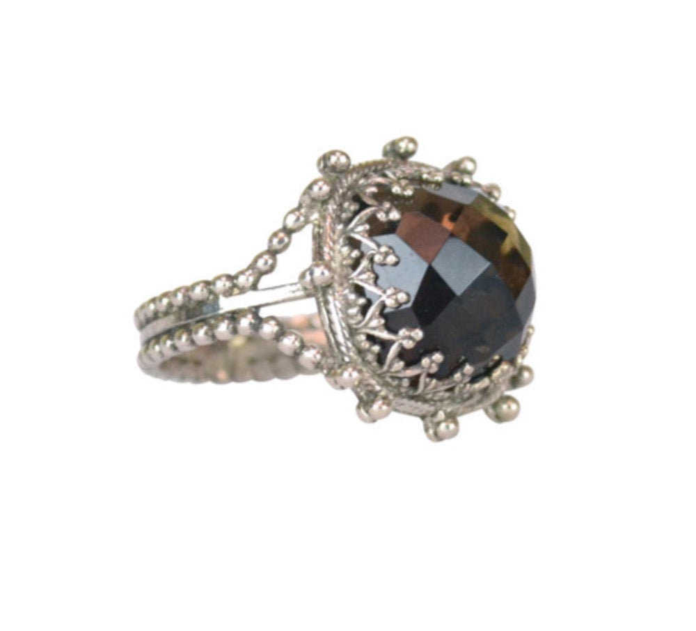 Delicate, elegant sterling silver ring. A 12mm cushion rose cut smoky quartz stone is set in a lacy bezel, with elegant shank. This is a ring that you will love wearing and will cherish for years to come.  Ring comes in  size 4.5 to 12 in half sizes.  Materials: Sterling Silver & Smoky Quartz