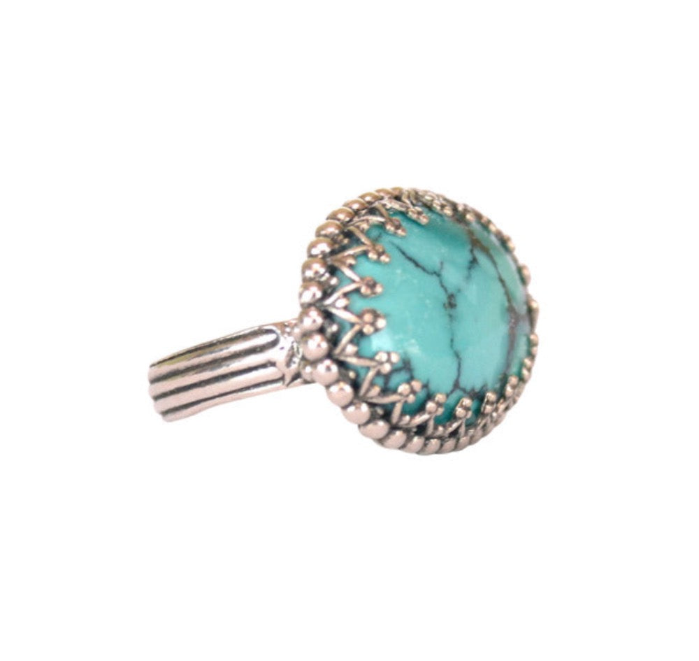 Turquoise Horizontal Oval Ring   Gorgeous, delicate & elegant sterling silver ring. Beautiful 18 x 13mm oval turquoise stone surrounded by lacy bezel and a simple but elegant shank. This is a ring that you will love wearing and will cherish for years to come. The ring comes in sizes 6.5, 7, 8, 9 & 9.5. This ring is made to order, so due to the nature of the stone, it will not be identical to the one photographed.  Materials: Sterling silver & turquoise